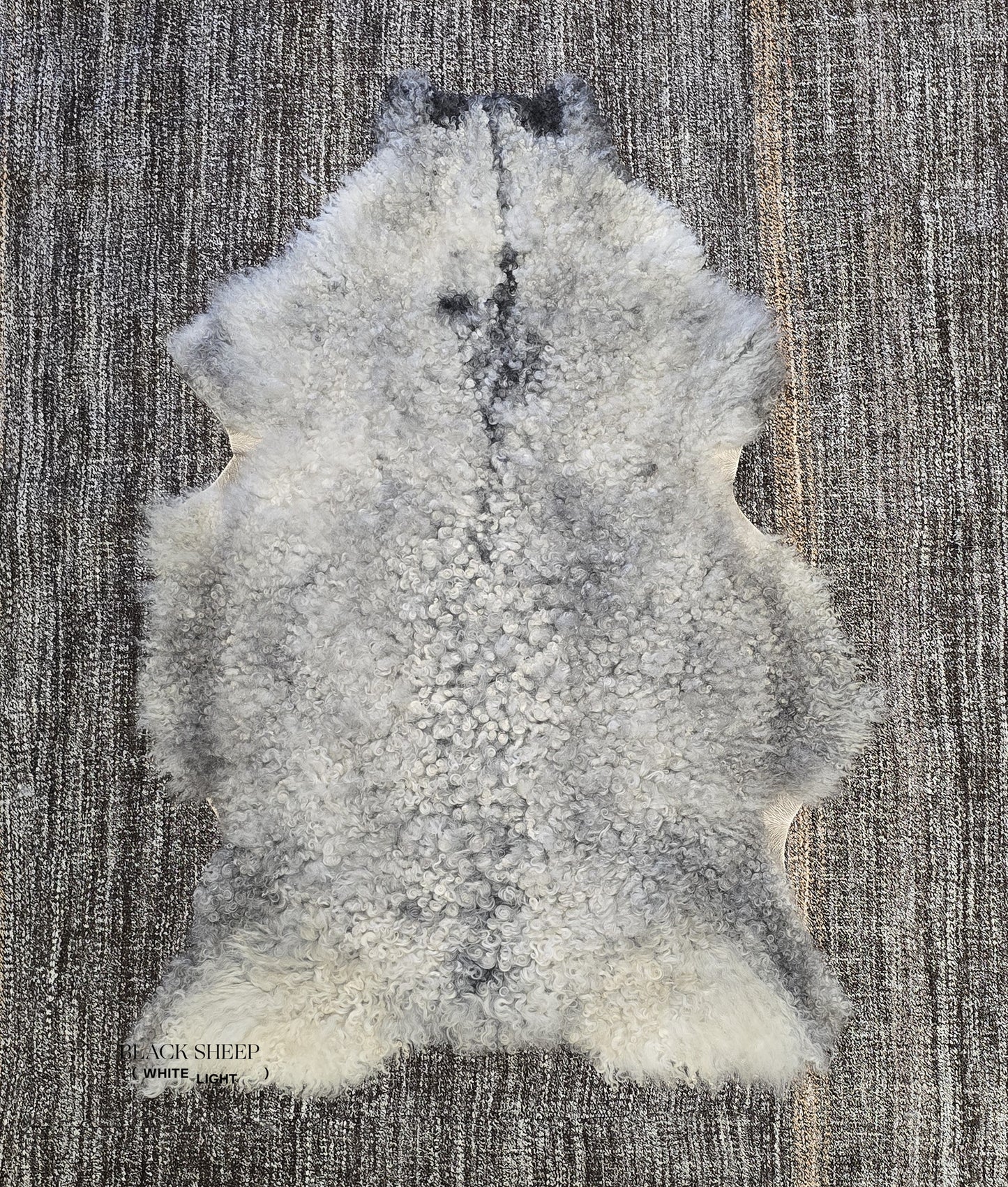ONE OF THE KIND Gotland White and Grey Medium Wool Sheepskin - Black Sheep (White Light)