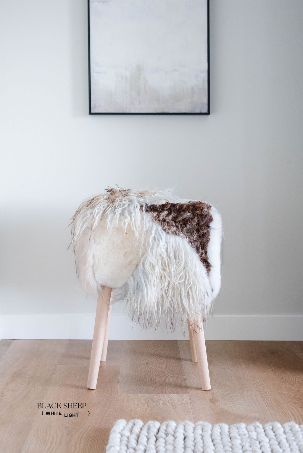 Mélange Sheepskin Stool, curly wool - Black Sheep (White Light)