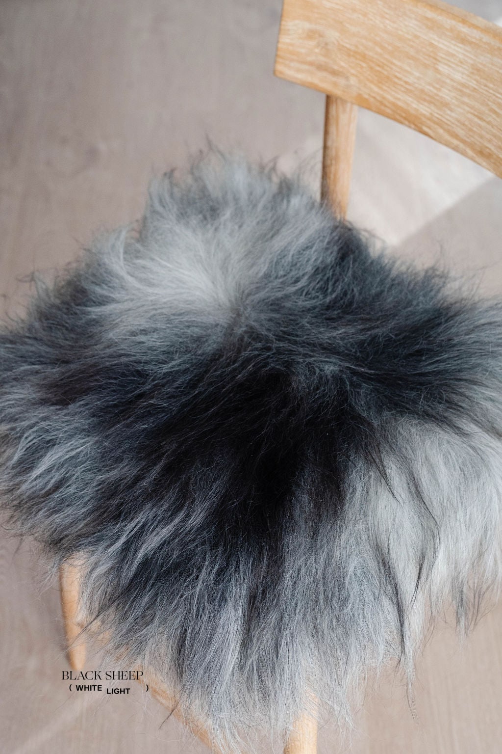 Dark Grey Icelandic Sheepskin Chair Pad - Black Sheep (White Light)