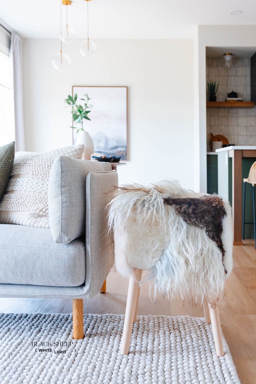 Mélange Sheepskin Stool, curly wool - Black Sheep (White Light)
