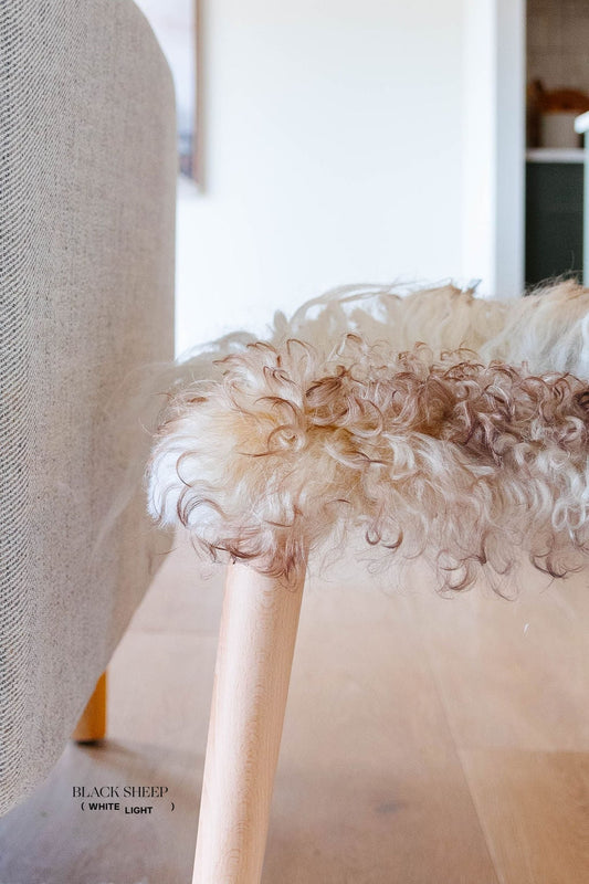 Mélange Sheepskin Stool, cushionless - Black Sheep (White Light)