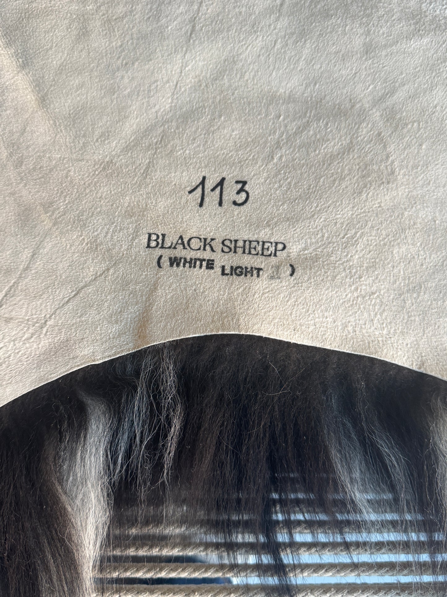 ONE OF A KIND Black Long wool Icelandic Sheepskin with White Side Locks