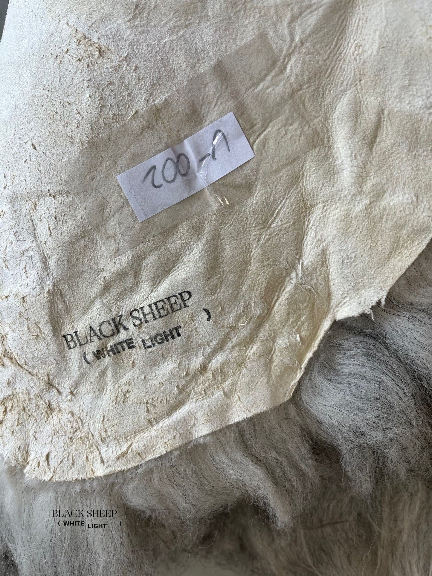 ONE OF THE KIND Gray Icelandic Sheepskin - Black Sheep (White Light)