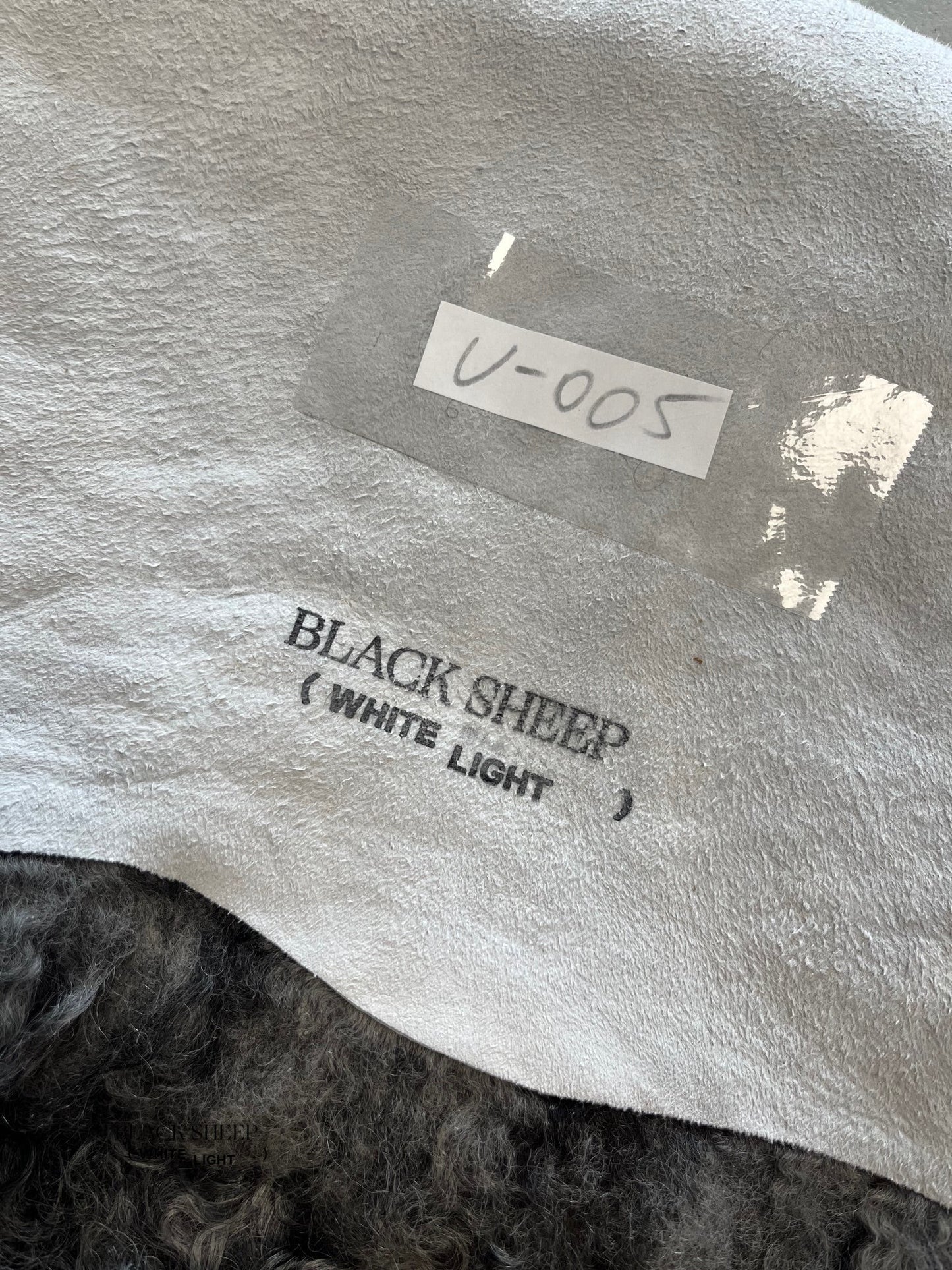 ONE OF THE KIND Gotland Grey Medium Wool Sheepskin - Black Sheep (White Light)