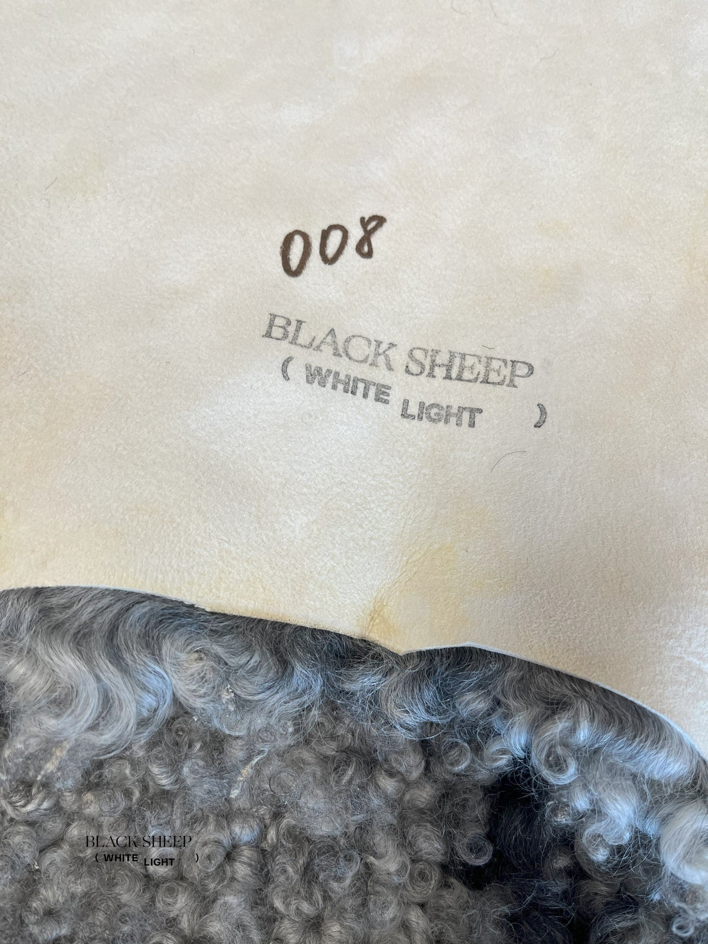 ONE OF THE KIND Gotland Grey Medium Wool Sheepskin - Black Sheep (White Light)