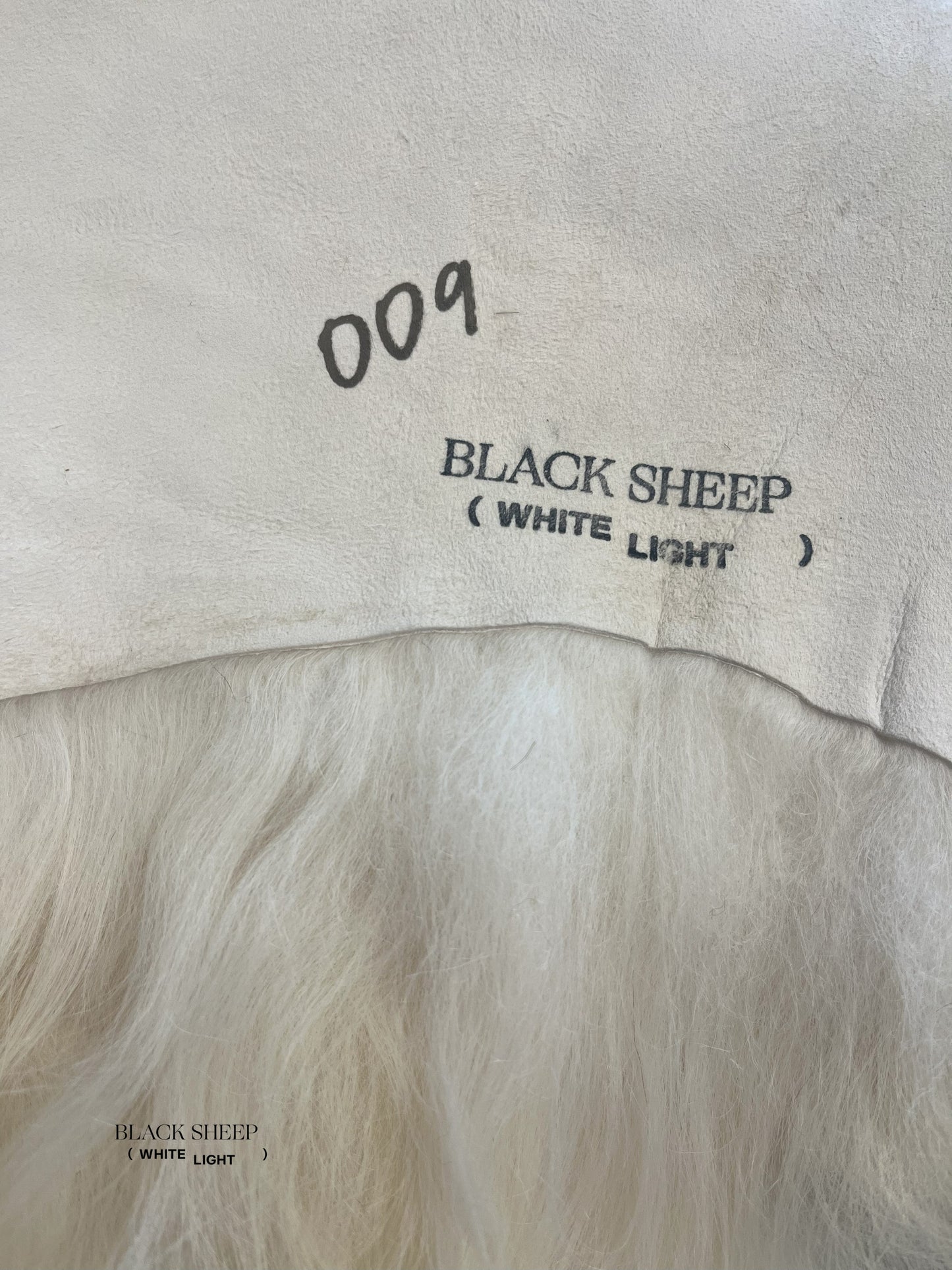 ONE OF THE KIND Icelandic White Sheepskin - Black Sheep (White Light)