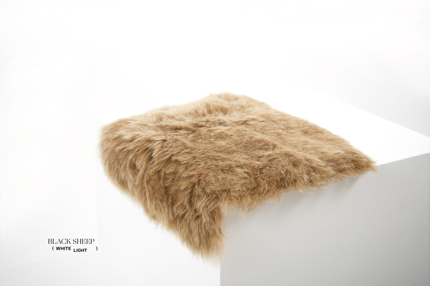 Shorn Brown Icelandic Sheepskin Chair Pad - Black Sheep (White Light)
