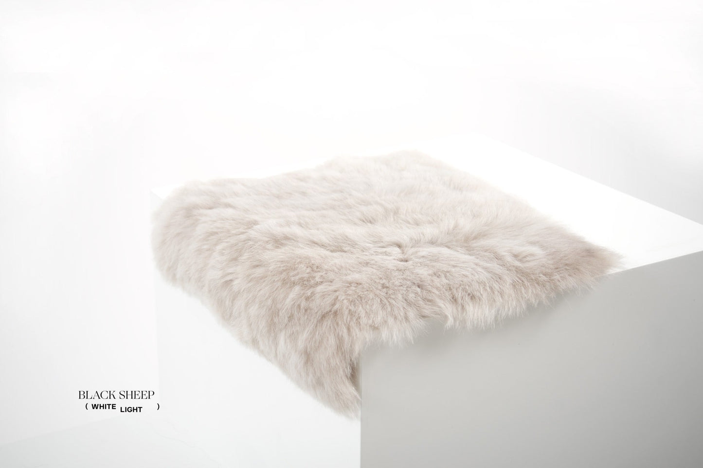 Shorn Linen Icelandic Sheepskin Chair Pad - Black Sheep (White Light)