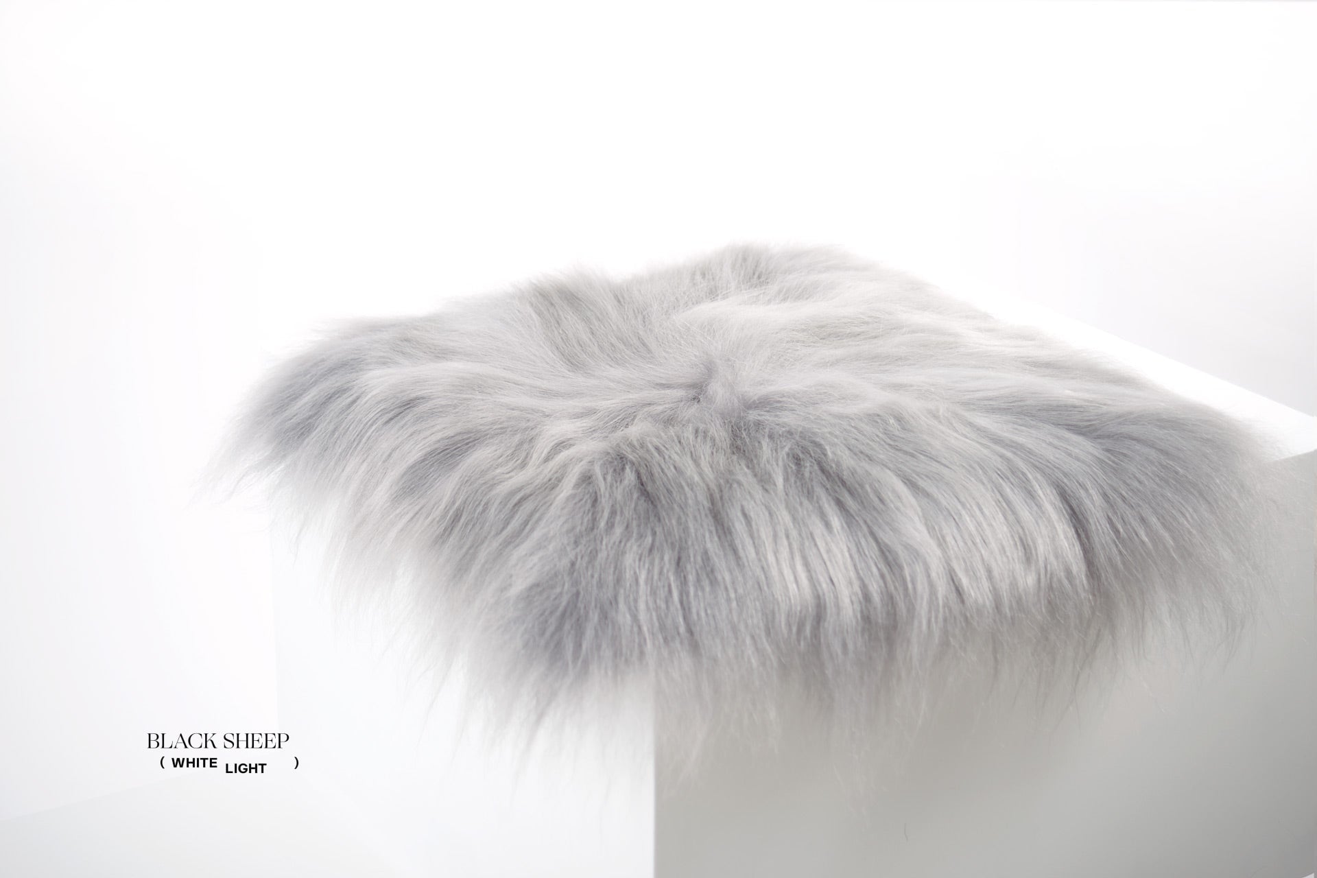 Silver Icelandic Sheepskin Chair Pad - Black Sheep (White Light)