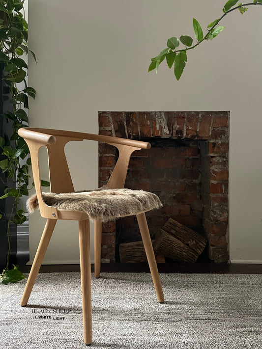 Shorn Brown Icelandic Sheepskin Chair Pad - Black Sheep (White Light)