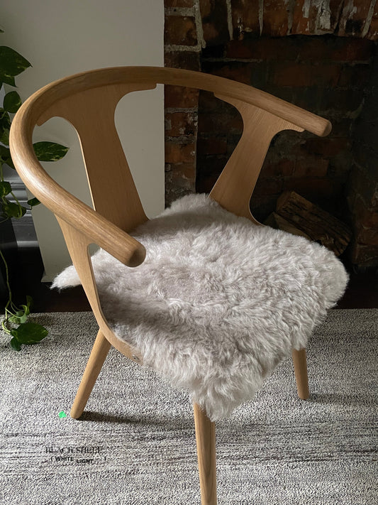Shorn Nude Icelandic Sheepskin Chair Pad - Black Sheep (White Light)