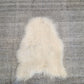 ONE OF THE KIND Icelandic White Sheepskin - Black Sheep (White Light)