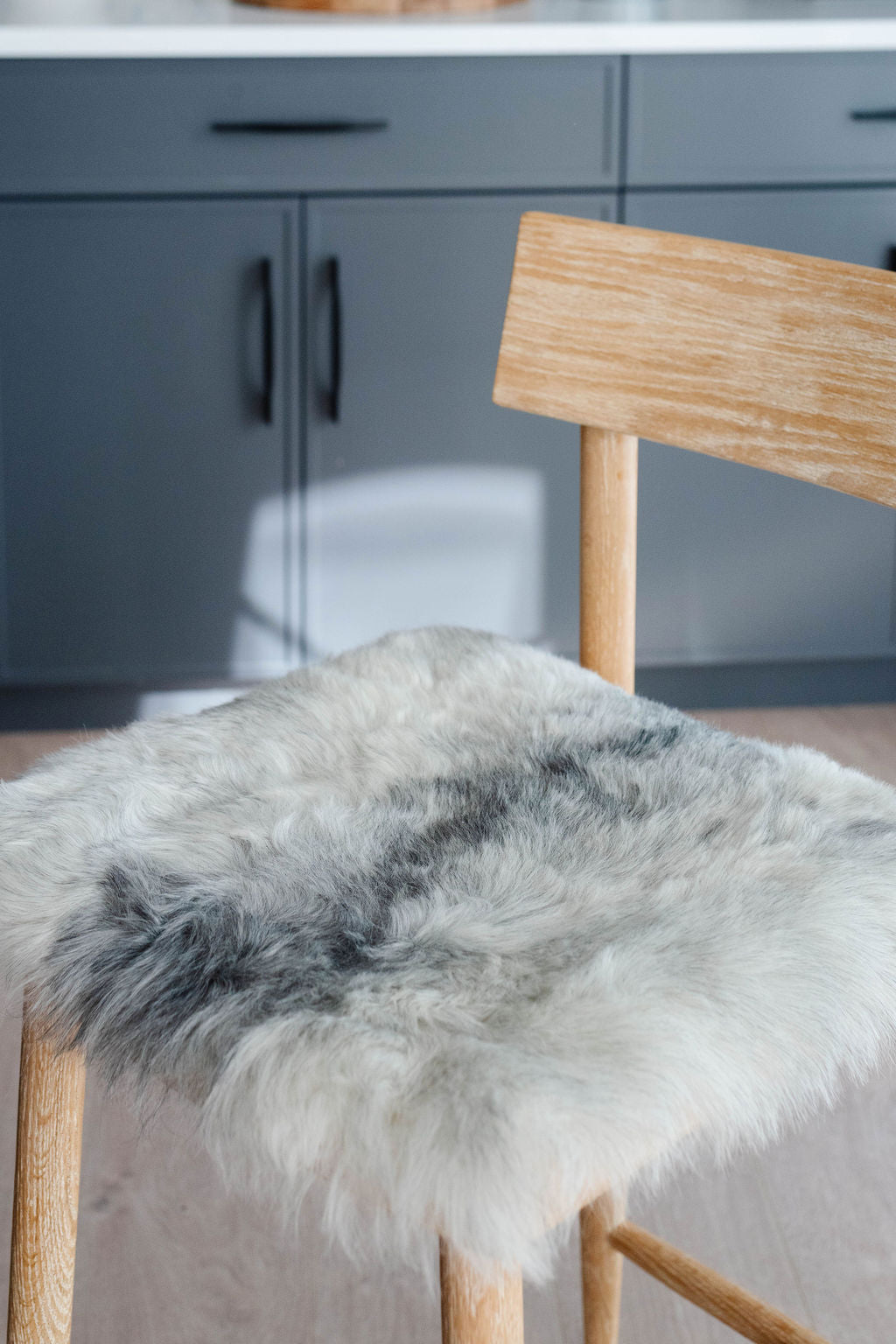 Shorn Grey Icelandic Sheepskin Chair Pad - Black Sheep (White Light)