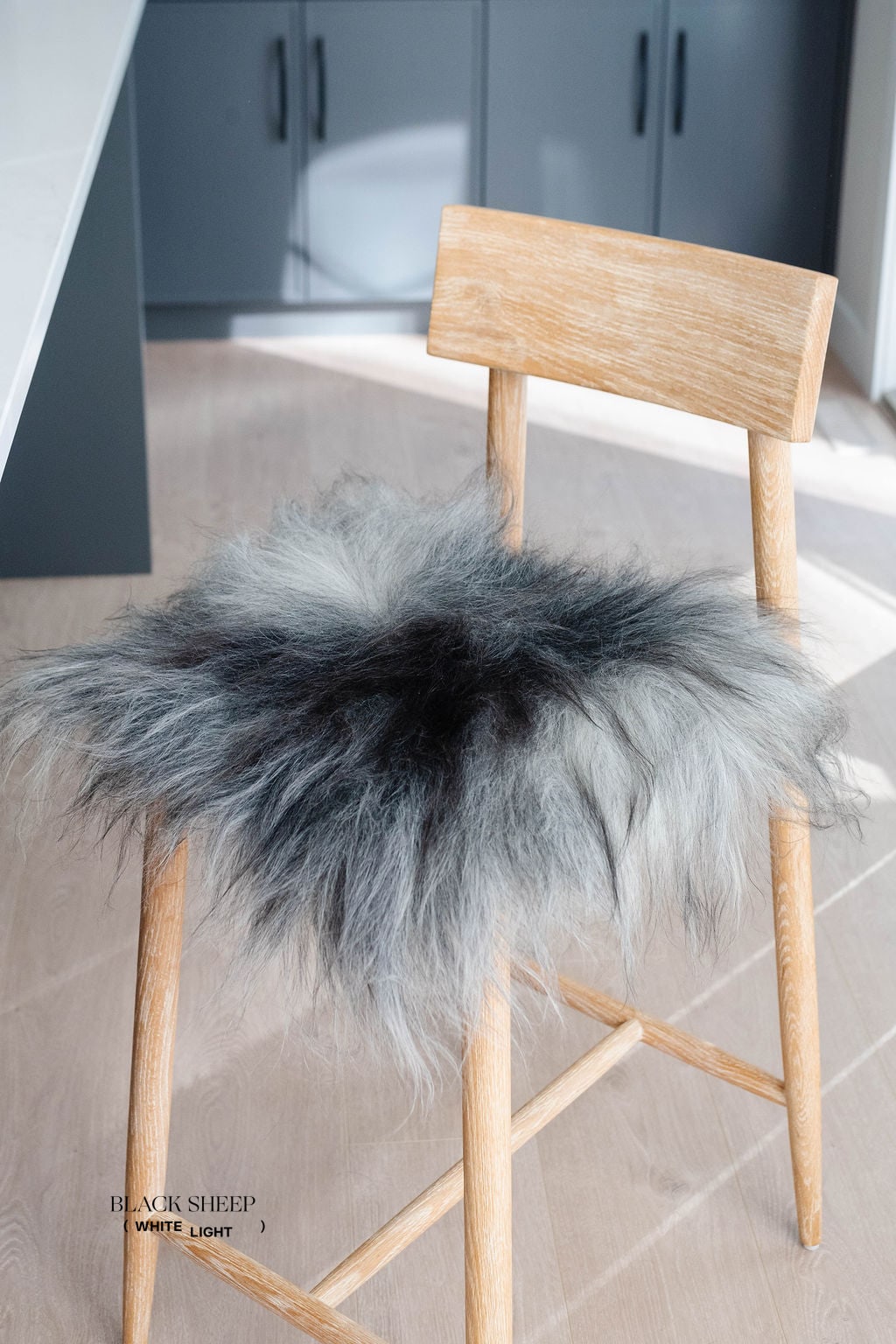 Dark Grey Icelandic Sheepskin Chair Pad - Black Sheep (White Light)