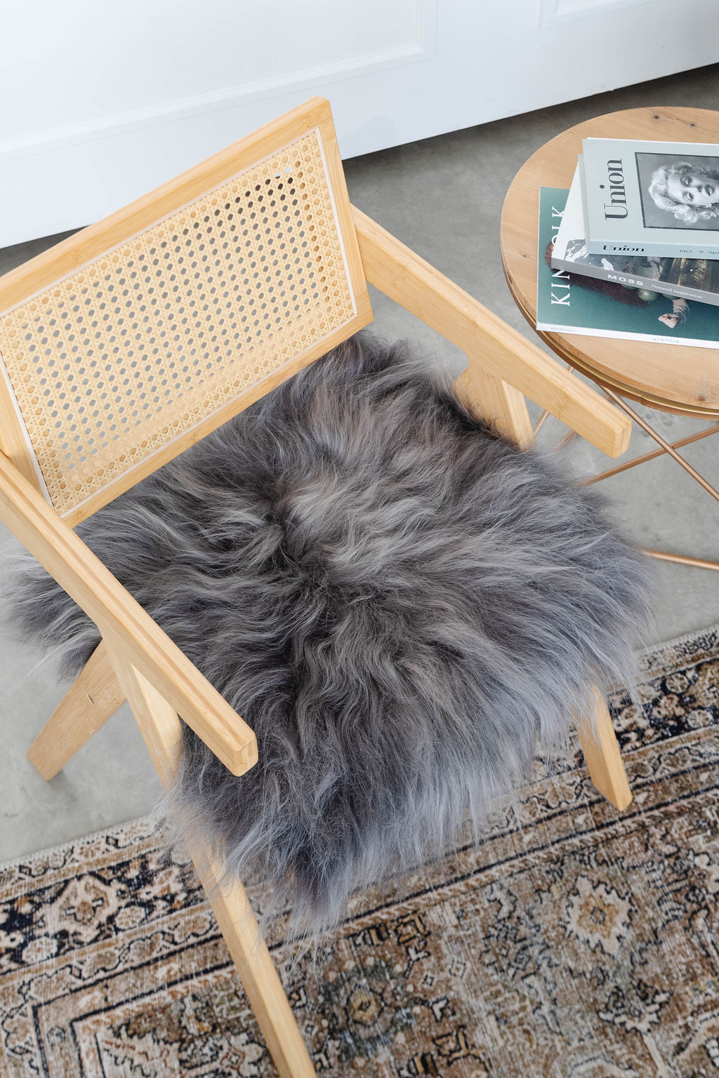 Mineral Grey Icelandic Sheepskin Chair Pad | Black Sheep (White Light)