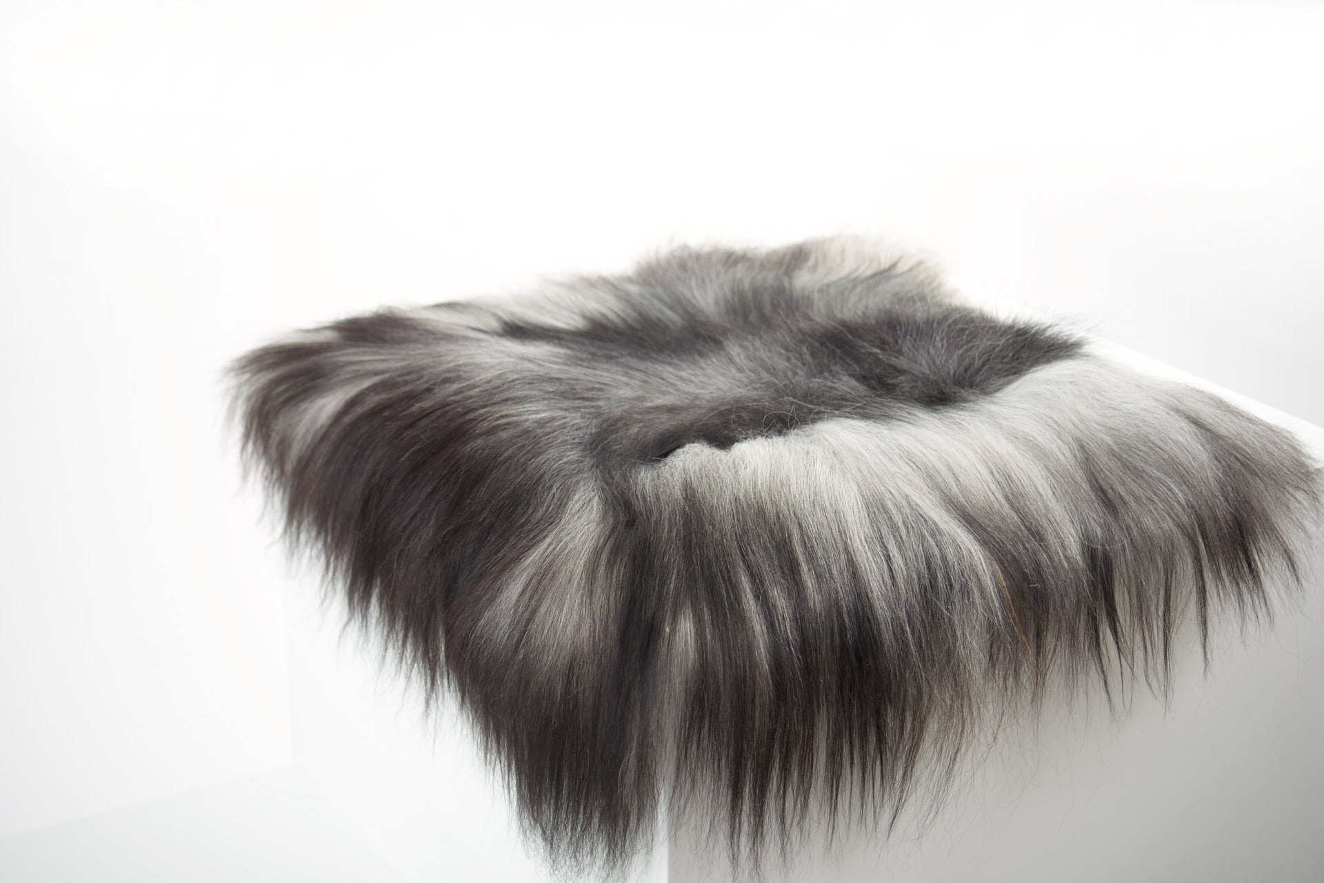 Grey Icelandic Sheepskin Chair Pad - Black Sheep (White Light)