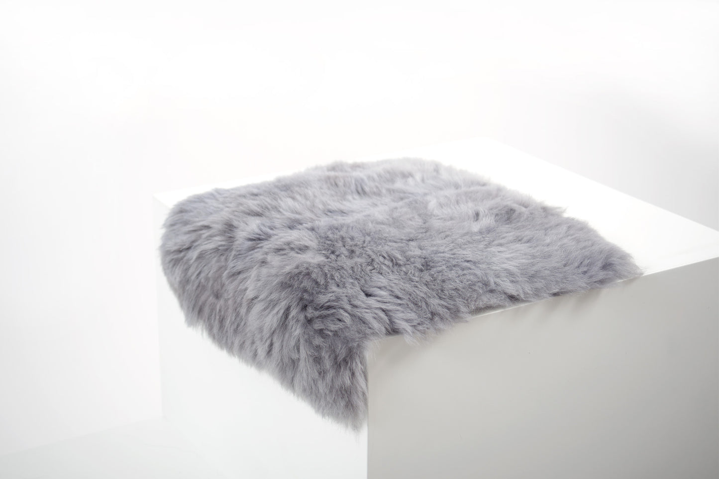 Shorn Silver Icelandic Sheepskin Chair Pad - Black Sheep (White Light)